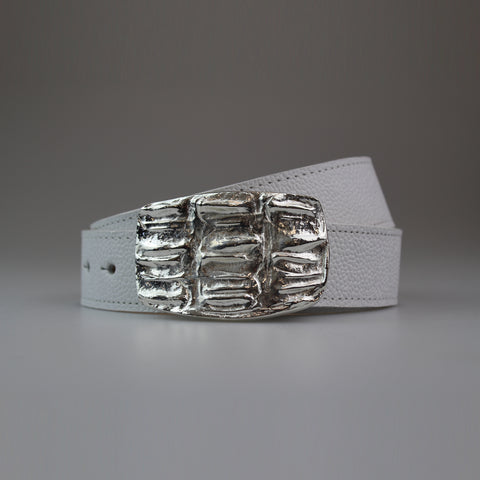 This Western Style Croc pattern buckle is attached to a fully lined calf strap, with tone on tone machine stitch. The buckle is solid brass finished with polished white metal. made by Sm Brown London