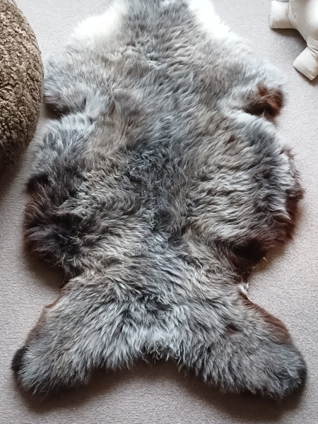 100% British alpaca natural colours in gray and soft browns. Not dyed. 