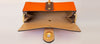 The Chelsea Clutch in Orange & Brown Grained Leather