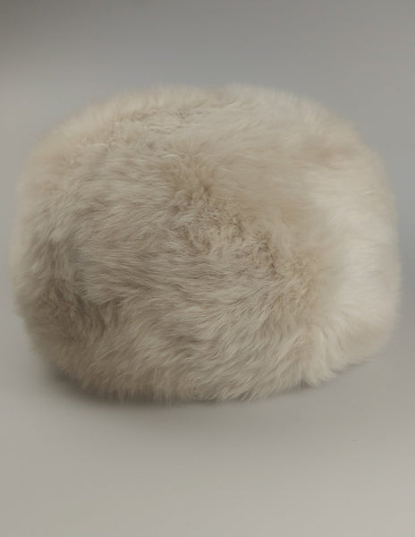 British sheepskin pouffe in creamy oyster colour_filled-with-wool-sheepskin-offcuts