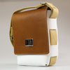 Side_view_showing_Tan_white_leather_across_body_bag_with_tan_cotton_webbing_strap_made_England_by_Sam_Brown_London