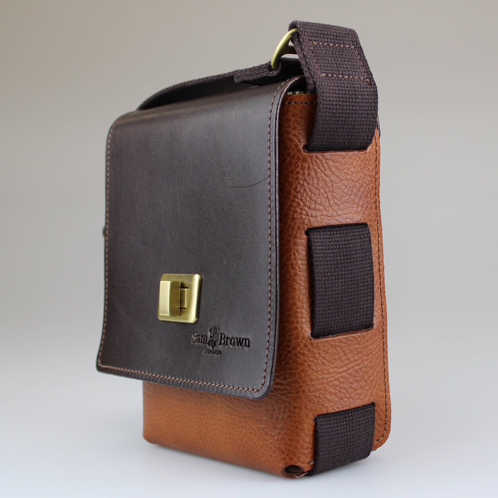 side shot of Compact across-body-bag English bridl leather in  tan & brown with cotton webbing strap Sam Brown London made in Wiltshire UK