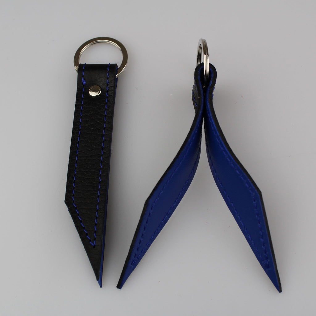 Elegant Black leather keyring to keep your keys secure. Hand-crafted from British full-grain leather,  two-toned for striking effect. Hardware in nickel Lined in soft blue leather made by Sam Brown London Wiltshire UK