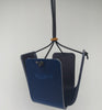 Dark Blue Leather plant pot hanger Height 11cm Width 7cm. Holds pot 9cm diameter. Made in Wiltshire UK BY Sam Brown London