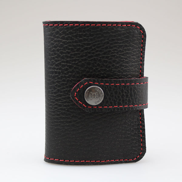 Elegant Black leather card wallet to keep cards secure. Hand-crafted from British full-grain leather,  two-toned for striking effect. Hardware in nickel Lined in soft red leather made by Sam Brown London Wiltshire UK