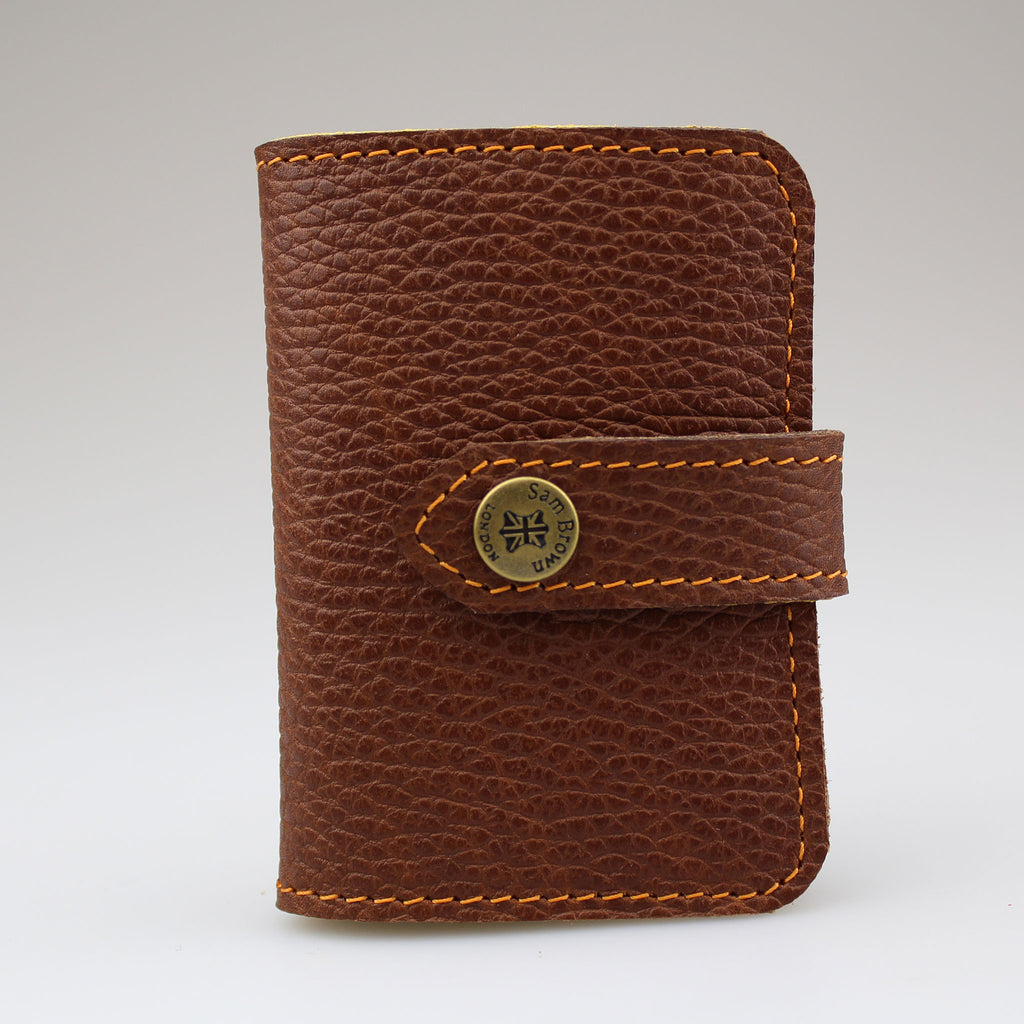 Elegant Brown leather card wallet to keep cards secure. Hand-crafted from British full-grain leather,  two-toned for striking effect. Hardware in brass Lined in soft yellow leather made by Sam Brown London Wiltshire UK