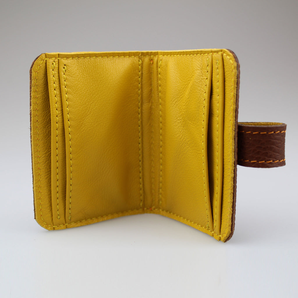 Elegant Brown leather card wallet to keep cards secure. Hand-crafted from British full-grain leather,  two-toned for striking effect. Hardware in brass Lined in soft yellow leather made by Sam Brown London Wiltshire UK