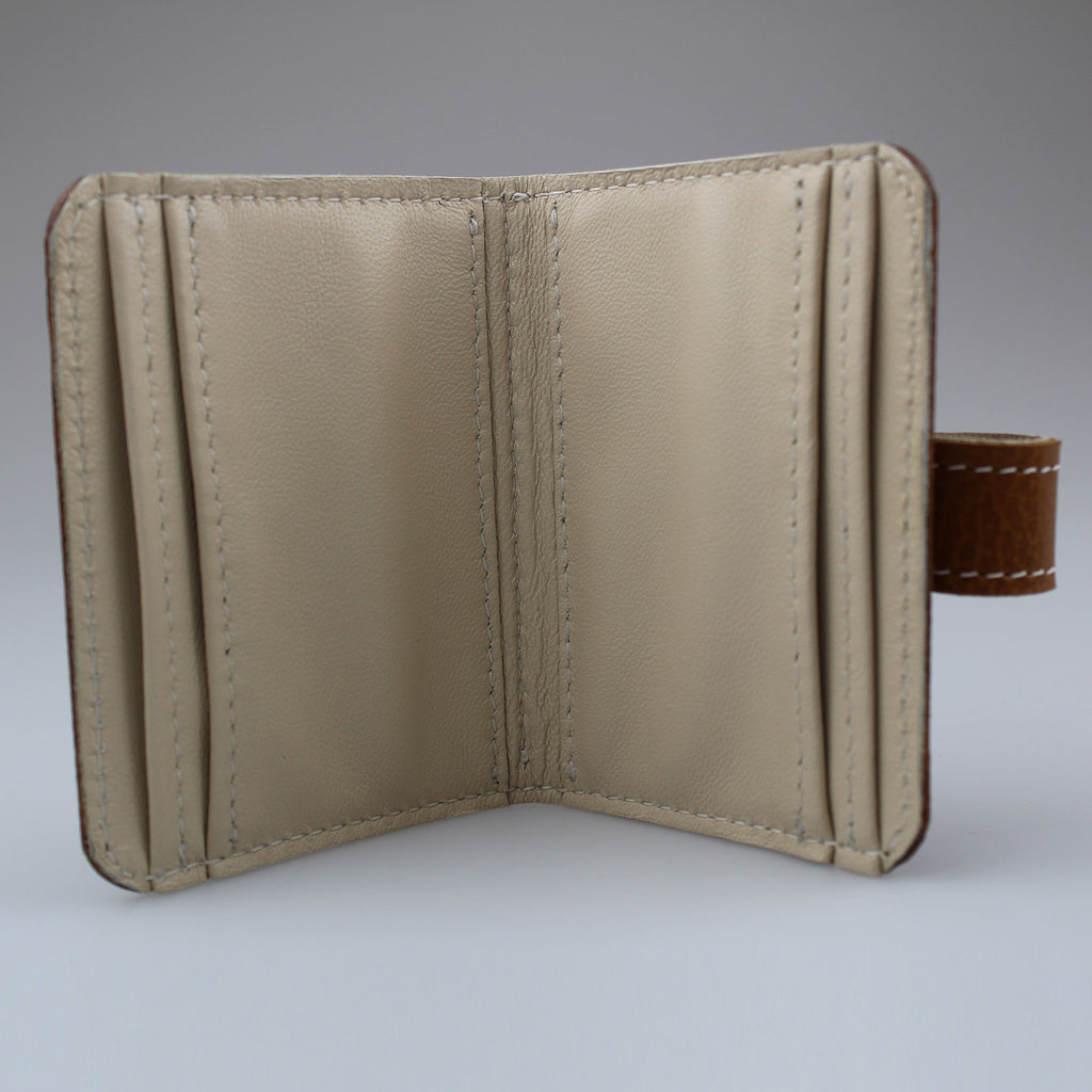 Elegant Tan leather card wallet to keep cards secure. Hand-crafted from British full-grain leather,  two-toned for striking effect. Hardware in brass Lined in sof ivory leather made by Sam Brown London Wiltshire UK