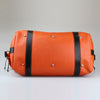 Sam-Brown-London-orange-leather-with-solid-nickel-stud-feet-on weekend-luggagebag