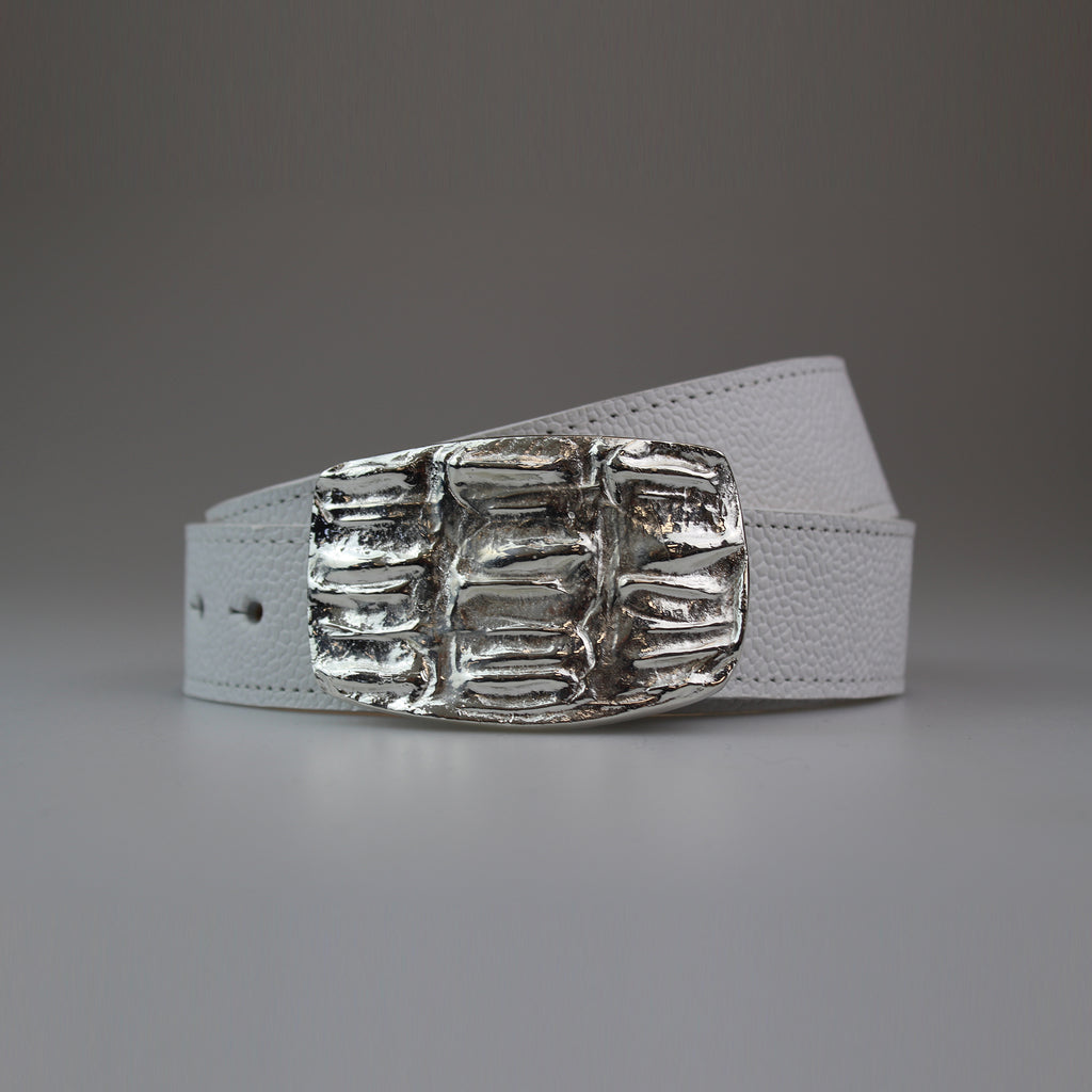 This Western Style Croc pattern buckle is attached to a fully lined calf strap, with tone on tone machine stitch. The buckle is solid brass finished with polished white metal. made by Sm Brown London
