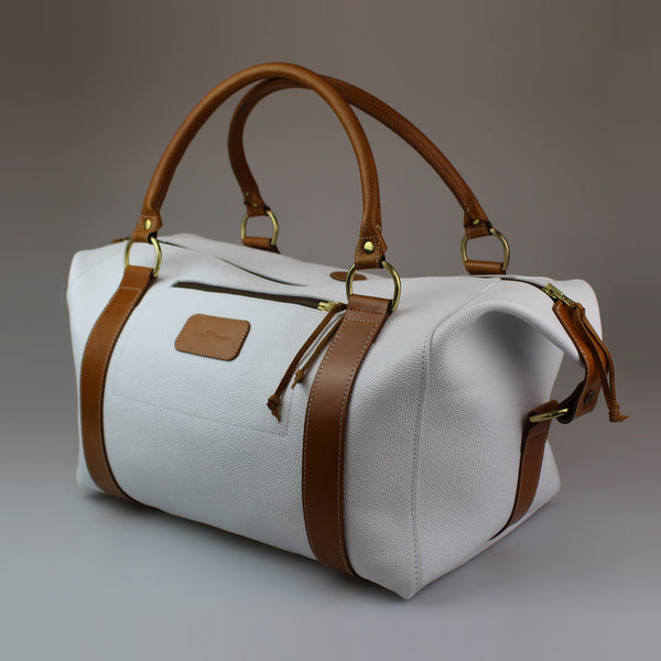 White 'caviar' pressed calf leather body with English bridle tan leather strapping and handles-outer zip pocket-lined-Harris-tweed Made in England-UK